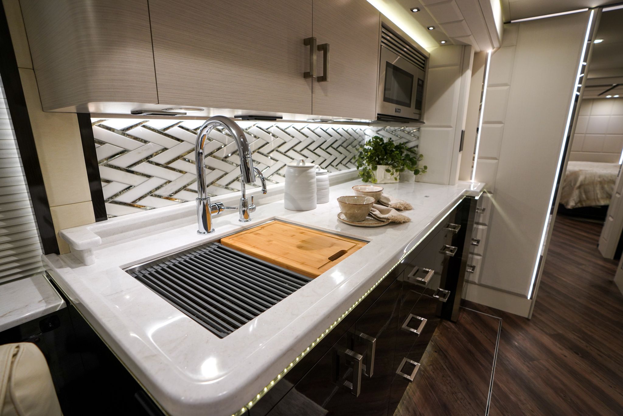 A luxurious coach cabin interior with modern lightning and cabinets