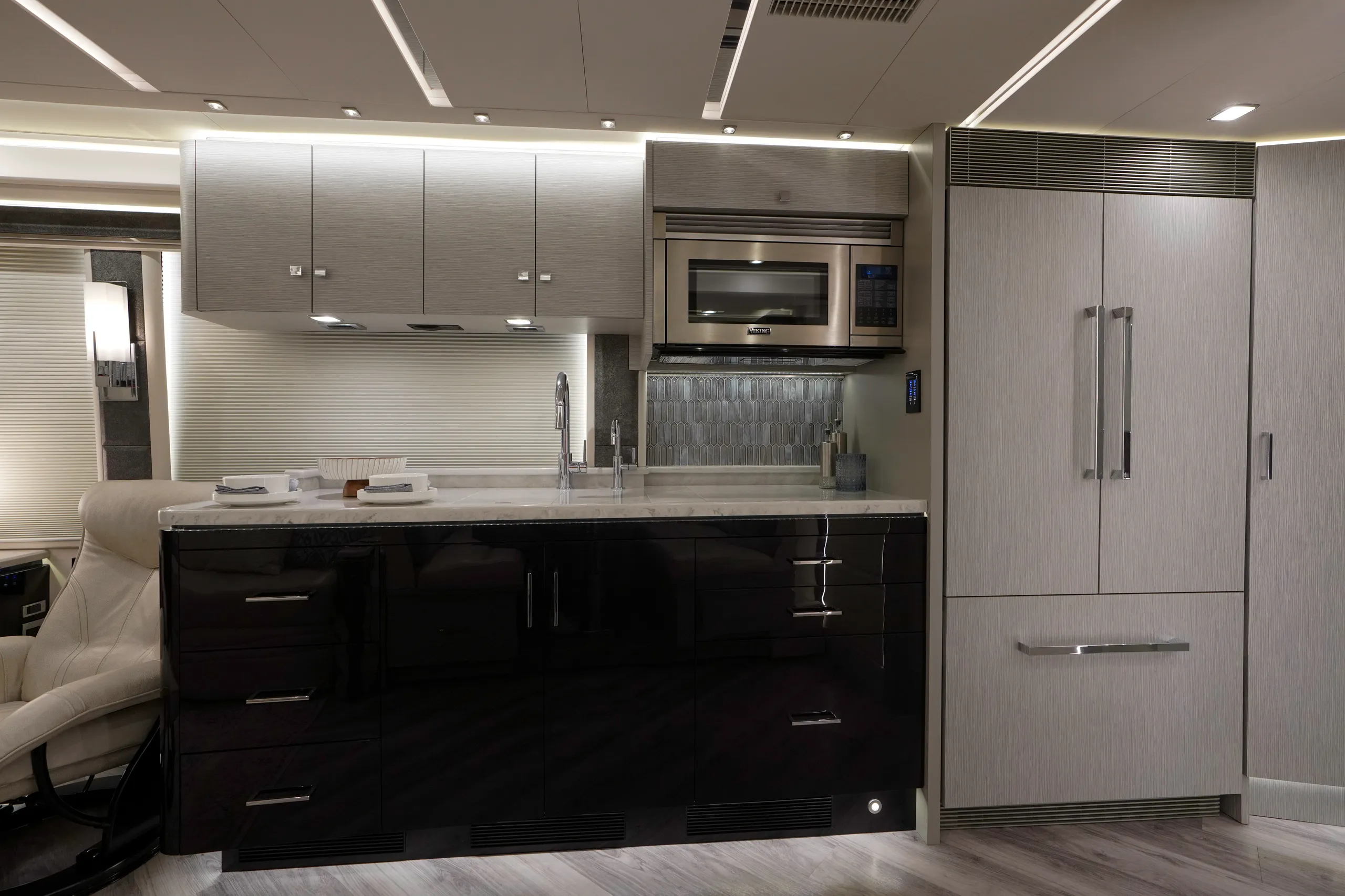 A modern and sleek kitchen with silver fixtures