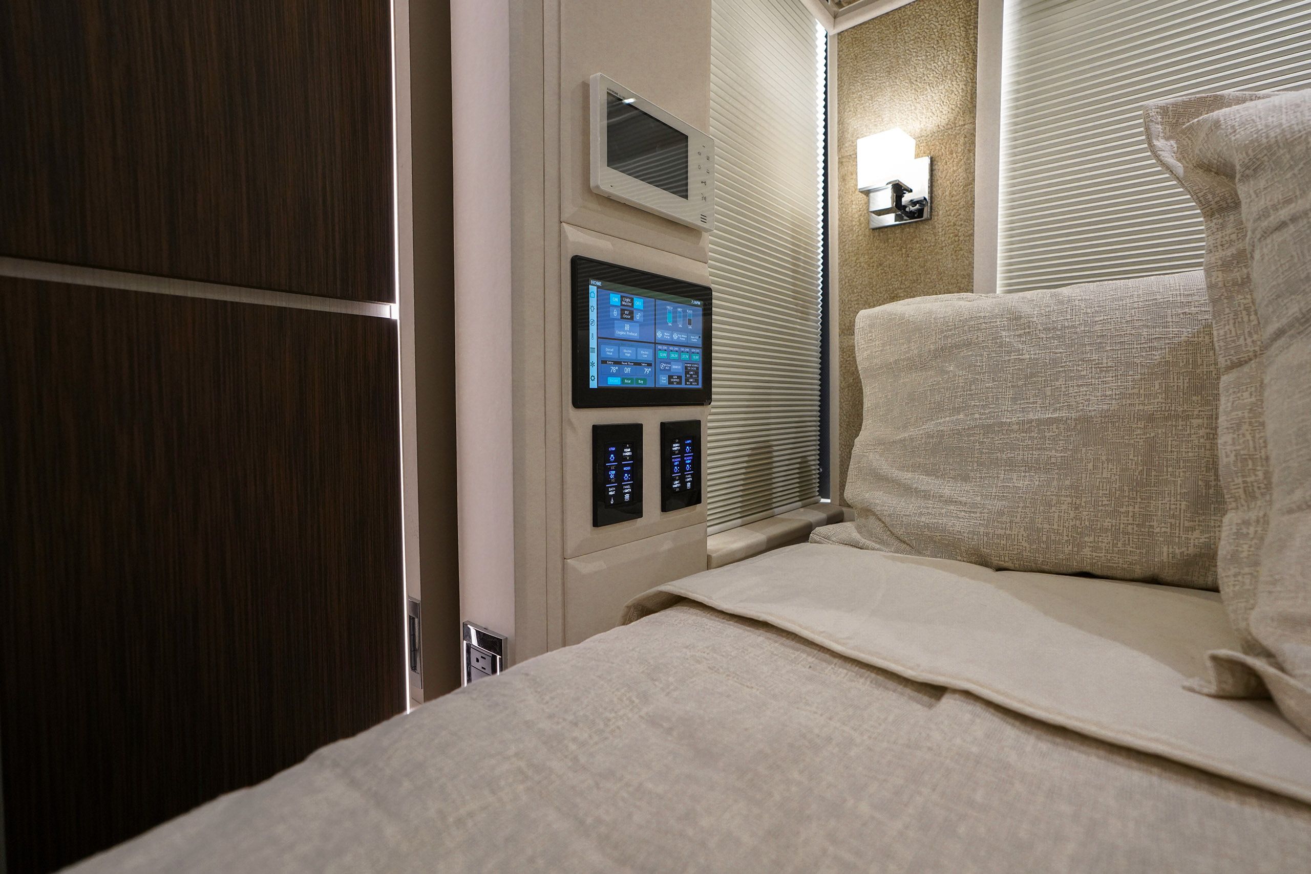 A warm, tan, brown, and cream colored cabin interior with cabinet lighting