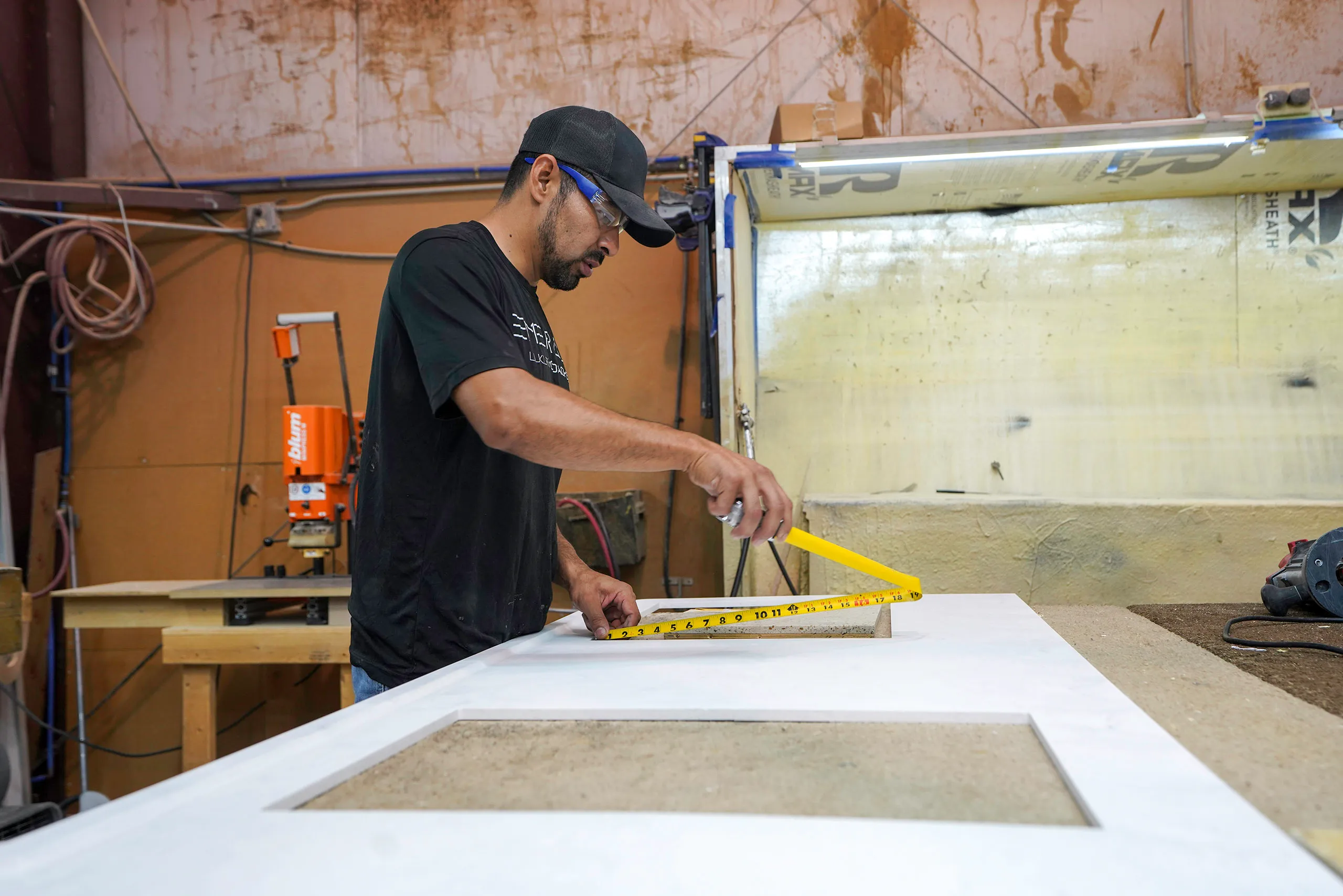 An Emerald Luxury Motorcoaches employee hard at work preparing materials