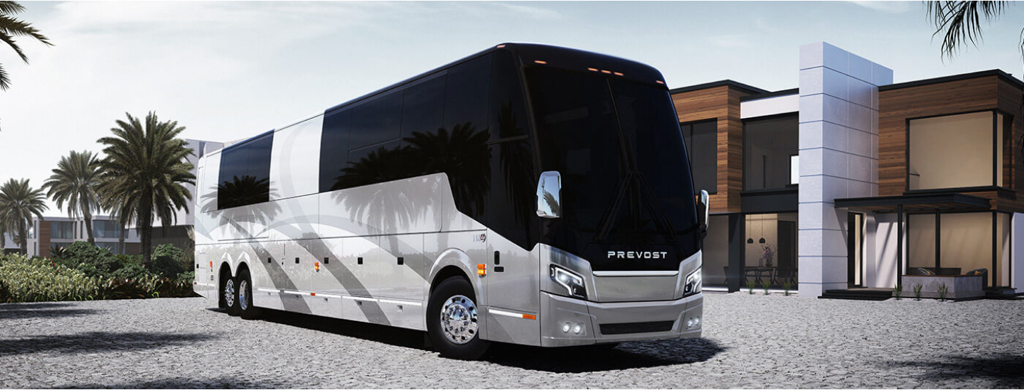 A luxurious motorcoach with high-tech wheels and mirrors