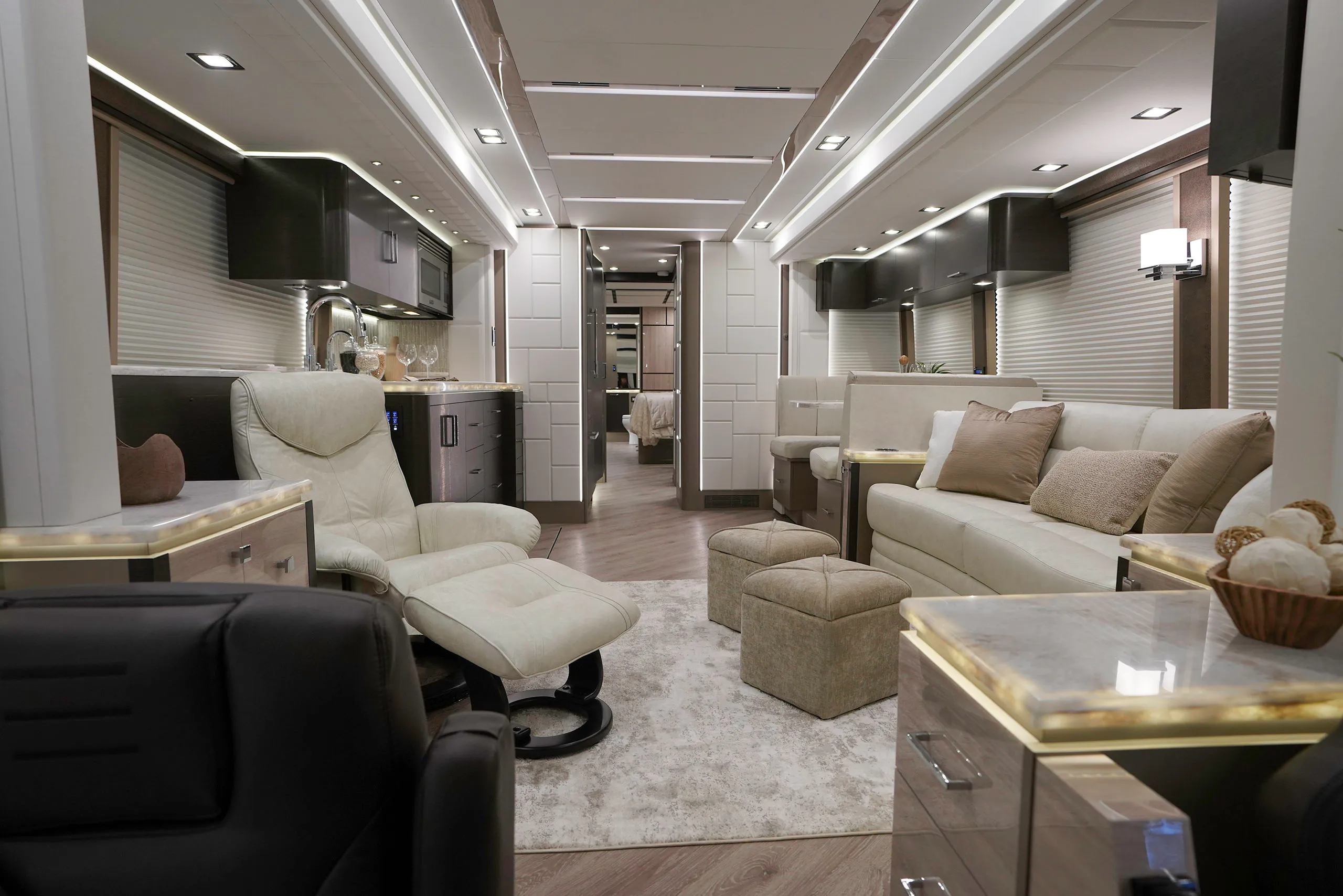 A luxury coach interior featuring fine furnishings and tabletops